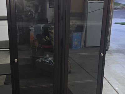 (2) Nice real wood black cabinets with glass doors