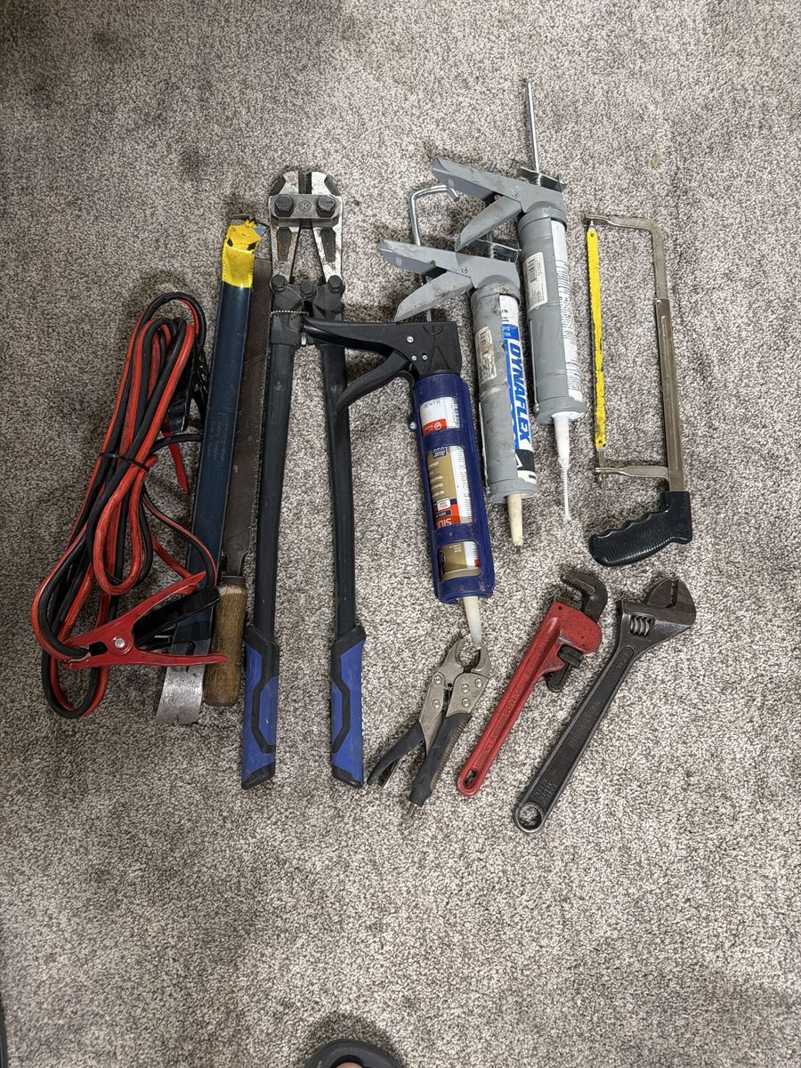 Mixed Tool Lot: Bolt Cutters, Caulking Guns, Wrenches, Jumper Cables, Saw, Pry Bars