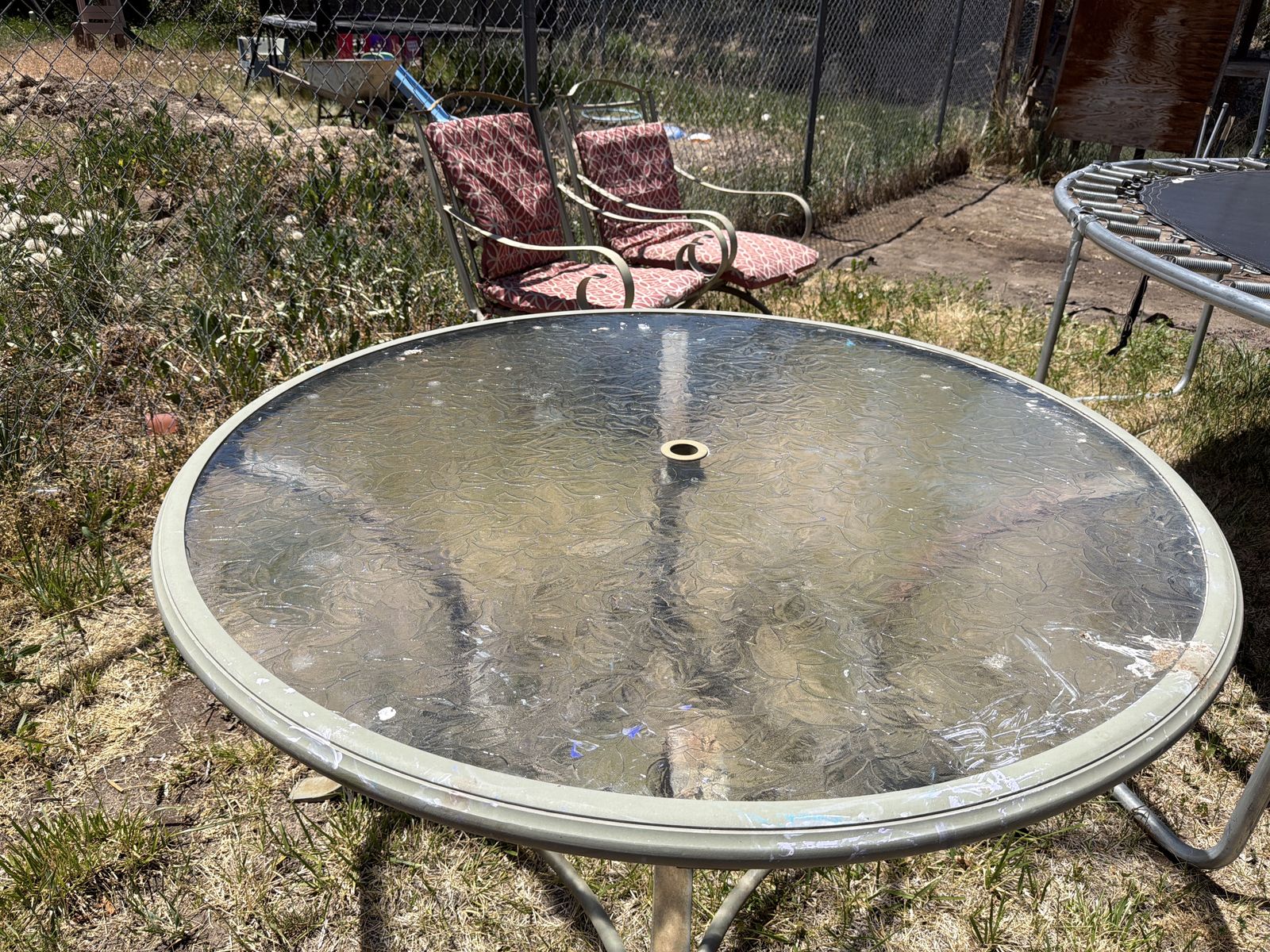 Outdoor table with five chairs.