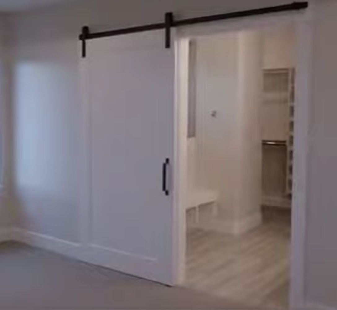 White Sliding Barn Door with Black Metal Track Hardware