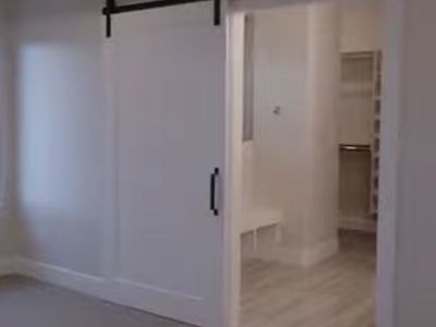 White Sliding Barn Door with Black Metal Track Hardware
