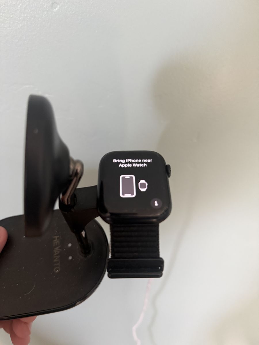 Apple Watch Series 8 45mm- Black with Black Band on Charging Stand