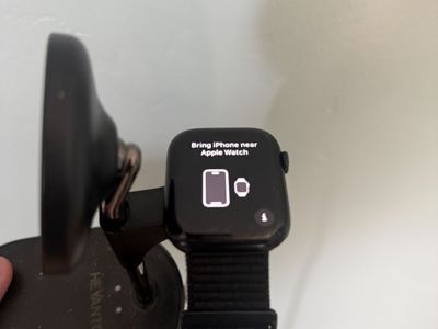 Apple Watch Series 8 45mm- Black with Black Band on Charging Stand