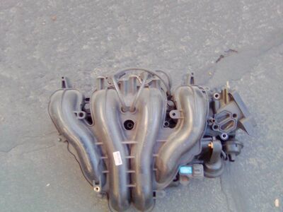 2005 Mazda 3 2.3 liter air intake.