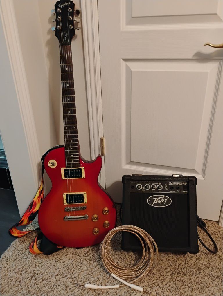 Epiphone Les Paul 100 , Peavey Backstage Amp, Strap, 15ft cable & headphones
