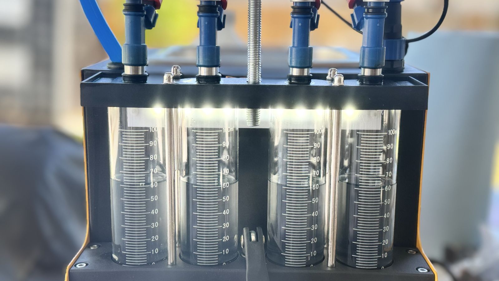 Fuel injector cleaning and flow test
