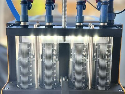 Fuel injector cleaning and flow test