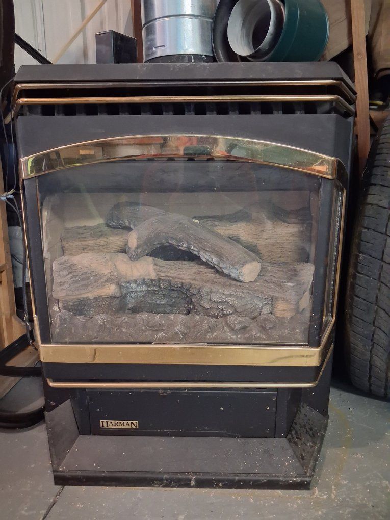 Harman Freestanding Fireplace/Wood Stove with Faux Logs, Black & Gold Trim