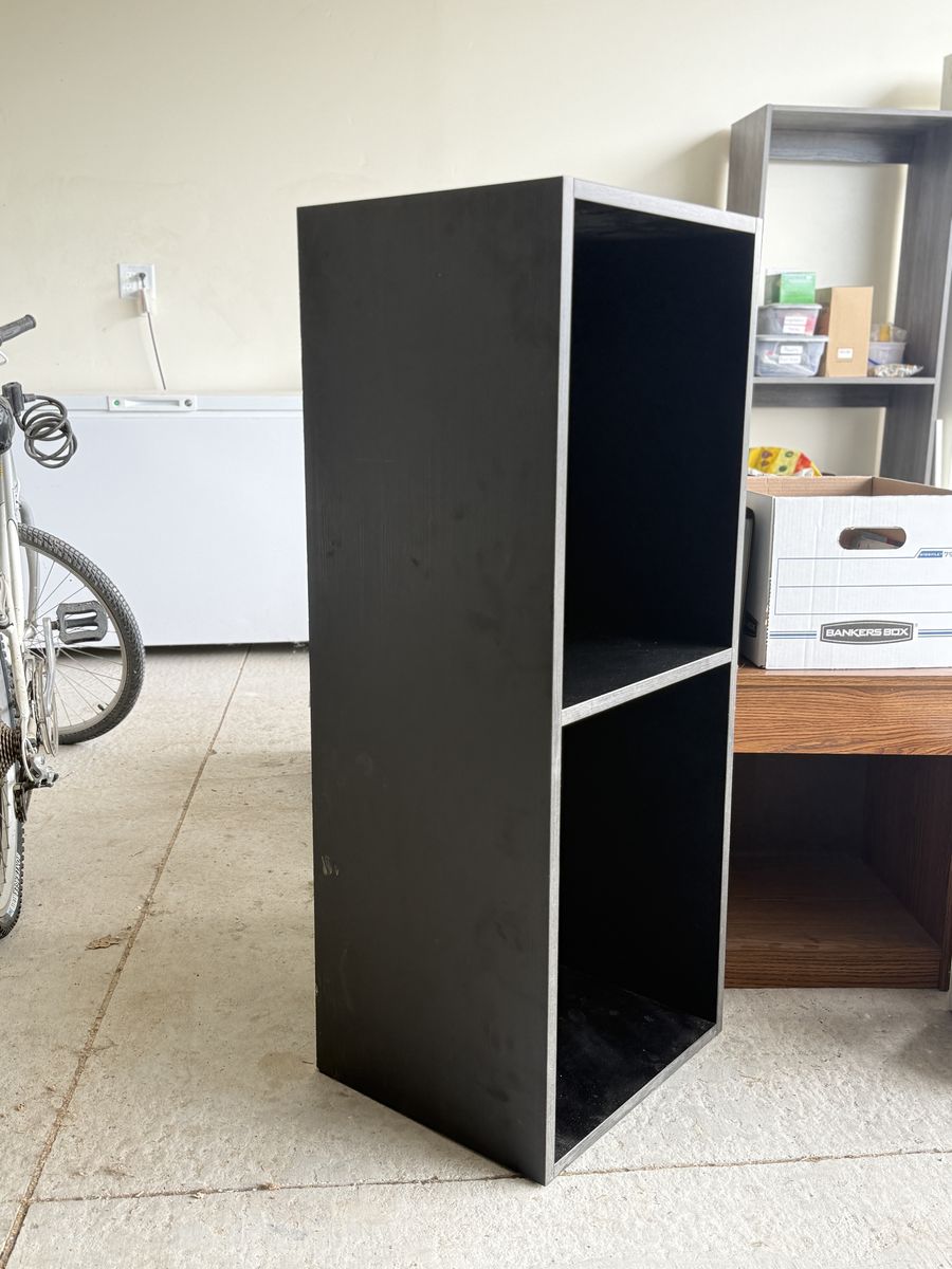2 solid, custom-built, black cabinets