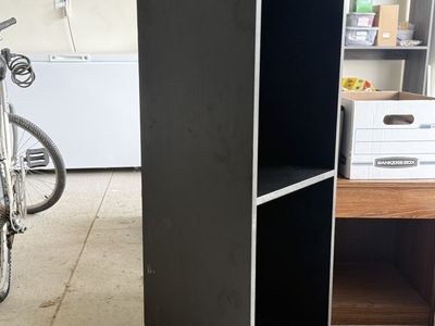 2 solid, custom-built, black cabinets