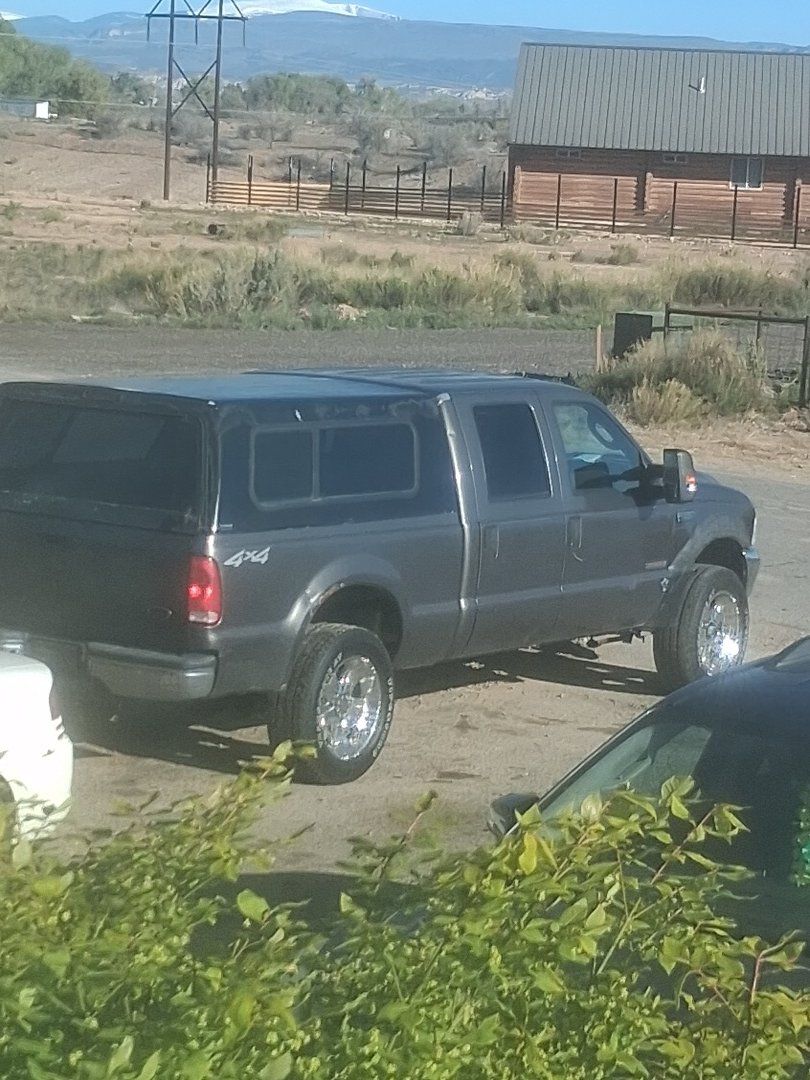 2004 f250 and 2003 f350 trade 1 for harley