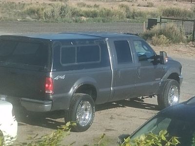 2004 f250 and 2003 f350 trade 1 for harley