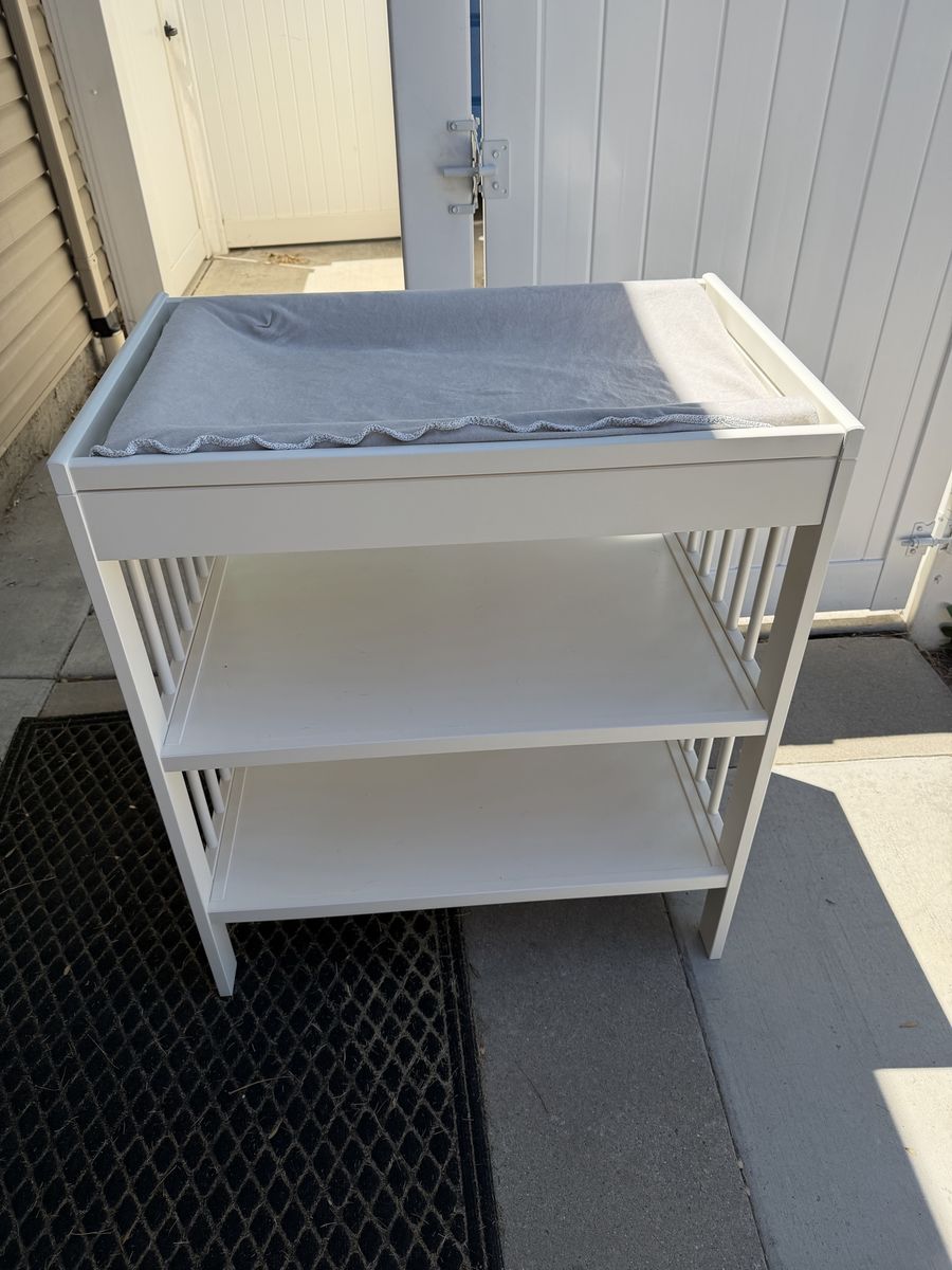 White Baby Changing Table with Storage Shelves and Changing Pad. IKEA brand