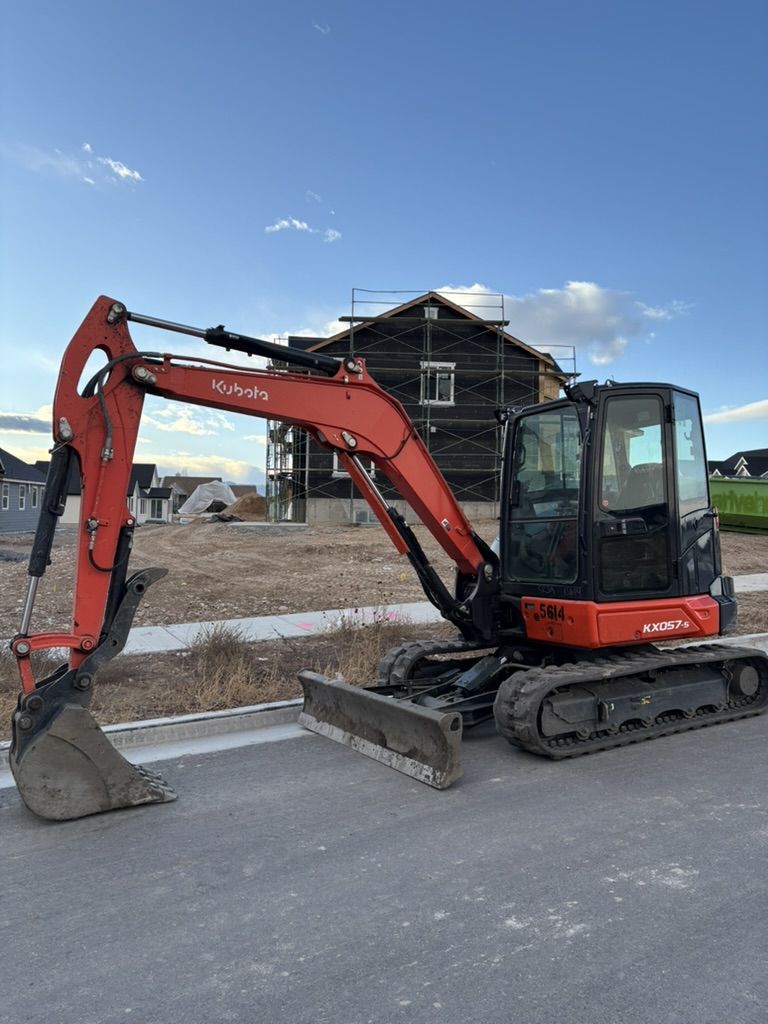 50 Class Mini Excavator. KX057-5 For Rent. Angle Blade and Thumb