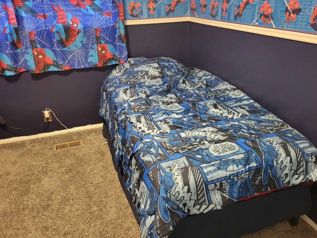 twin bed with strong frame, mattress, Spiderman sheets and blanket