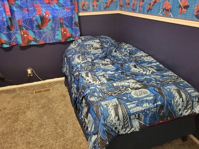 twin bed with strong frame, mattress, Spiderman sheets and blanket