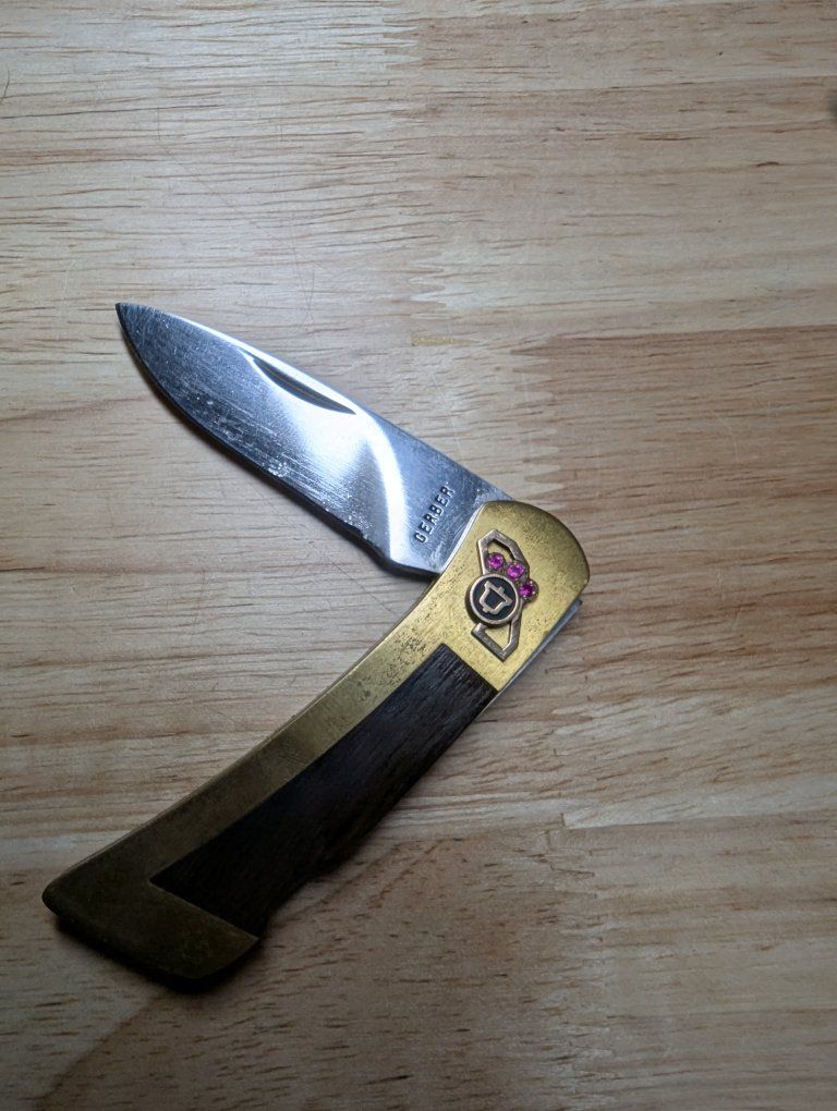 Gerber folding pocket knife with Pacific Bell emblem and 3 Rubies