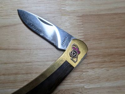Gerber folding pocket knife with Pacific Bell emblem and 3 Rubies