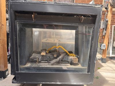 Used Gas Fireplace with Ceramic Logs and 2 sided Glass Door