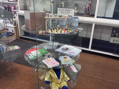 Four-Tier Glass Display Showcase with Curved Shelves