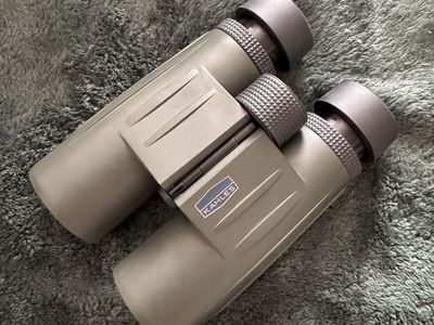 New never used Kahles 10x42 Binoculars with Camo Carrying Case