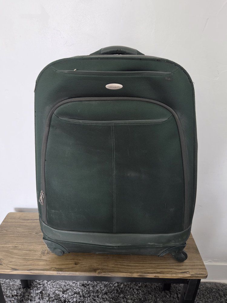 Durable Samsung suitcase with 4 really good wheels  and handle.

Green 4-wheels Rolling SAMSUNG Suitcase For Checked Luggage