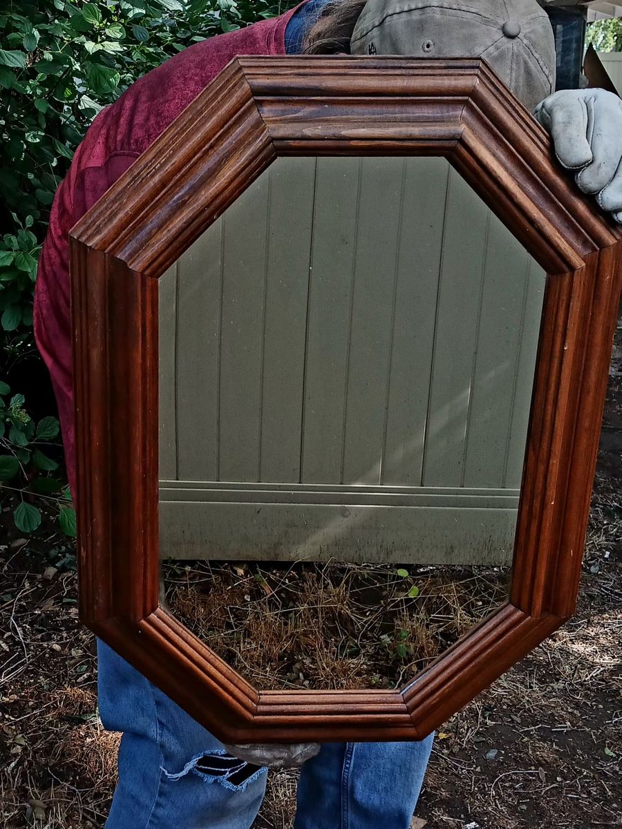 Octagon shaped mirror in wood frame