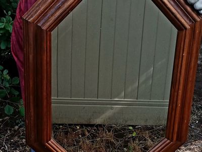 Octagon shaped mirror in wood frame