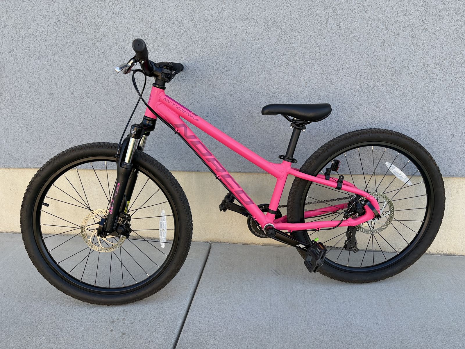Norco Storm 4.1 24" Kids Mountain Bike - Pink Hardtail w/ Disc Brakes