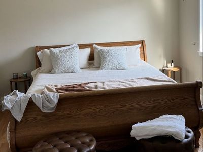 Large wooden sleigh bed