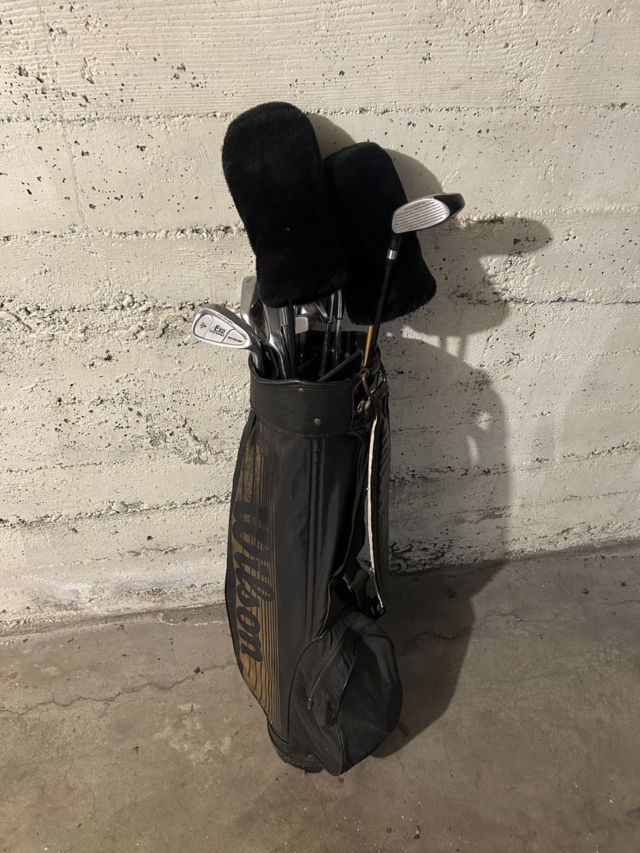 Used golf clubs with some balls, tees, and size 11 Footjoy shoes