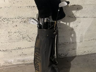 Used golf clubs with some balls, tees, and size 11 Footjoy shoes