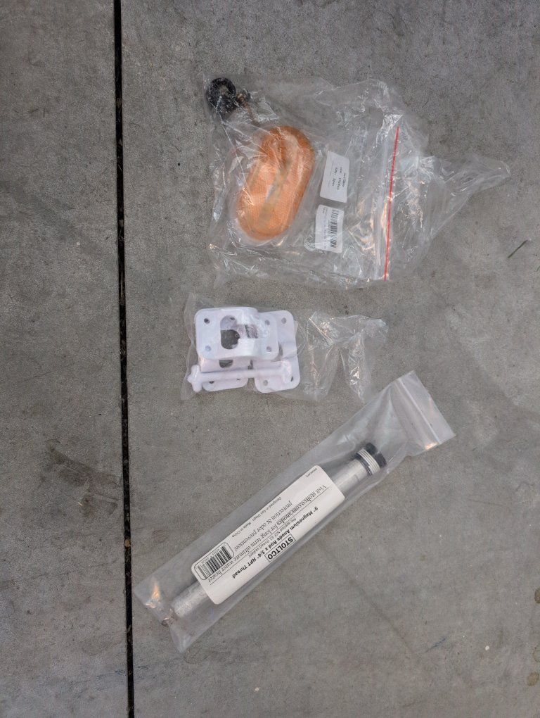 random RV pieces.  all new.  anode rod  door latch amber light
