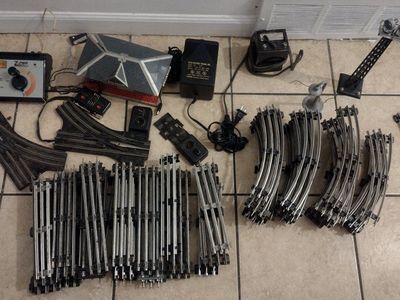 Vintage Post War Marx train sets w/2 transformers. Lots of O27 gauge track including everything in the pictures