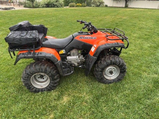 Honda Rancher 350 with snow plow.