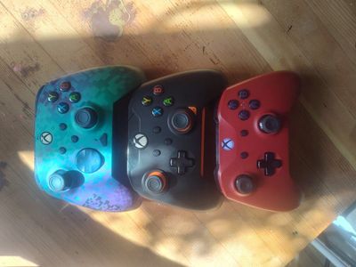 3 Xbox controllers one is a rematch