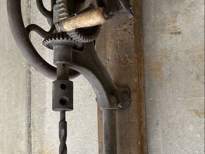 Antique wall mounted drill press