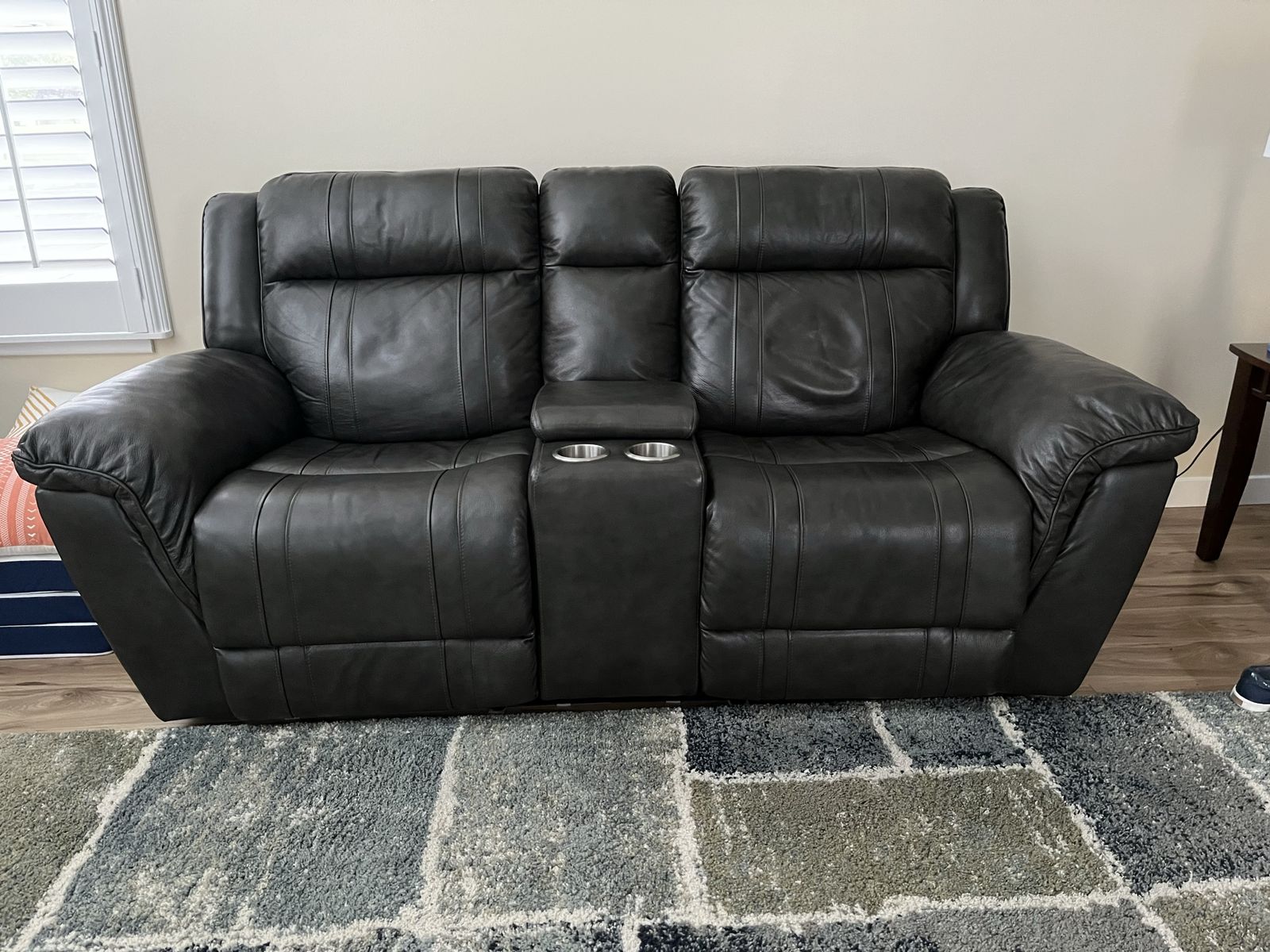 Dark gray Leather Reclining Loveseat with Console and Cupholders - Excellent Condition