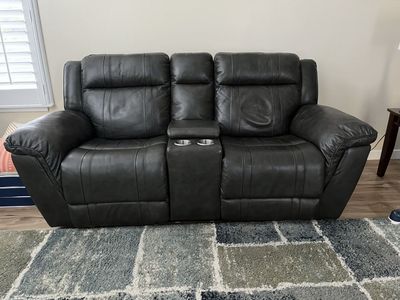 Dark gray Leather Reclining Loveseat with Console and Cupholders - Excellent Condition
