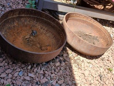 two 24 inch propane tanks ends.