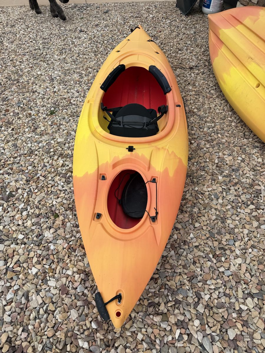 Pair of orange lifetime kayaks