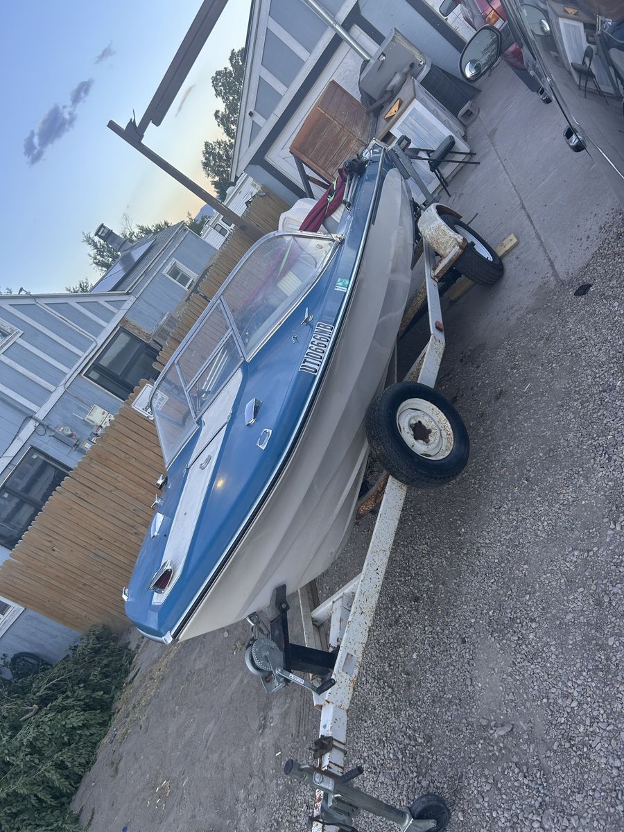 1966 Vintage Blue and White Motorboat with Single Axle Trailer