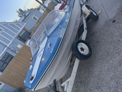 1966 Vintage Blue and White Motorboat with Single Axle Trailer