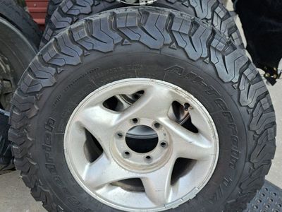 BFGoodrich All-Terrain T/A KO2 Tires LT265/70R16 with 16" Wheels & Toyota Center Caps