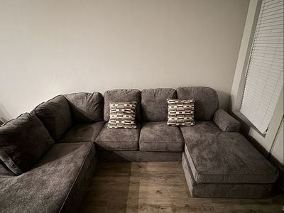 Large Gray U-Shaped Sectional Sofa with Throw Pillows