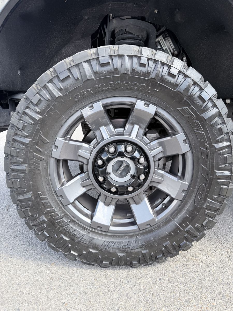 4 - 35x12.5x20 Nitto Trail Grappler M/T and 2024 20" OEM Lariat Ford Wheels