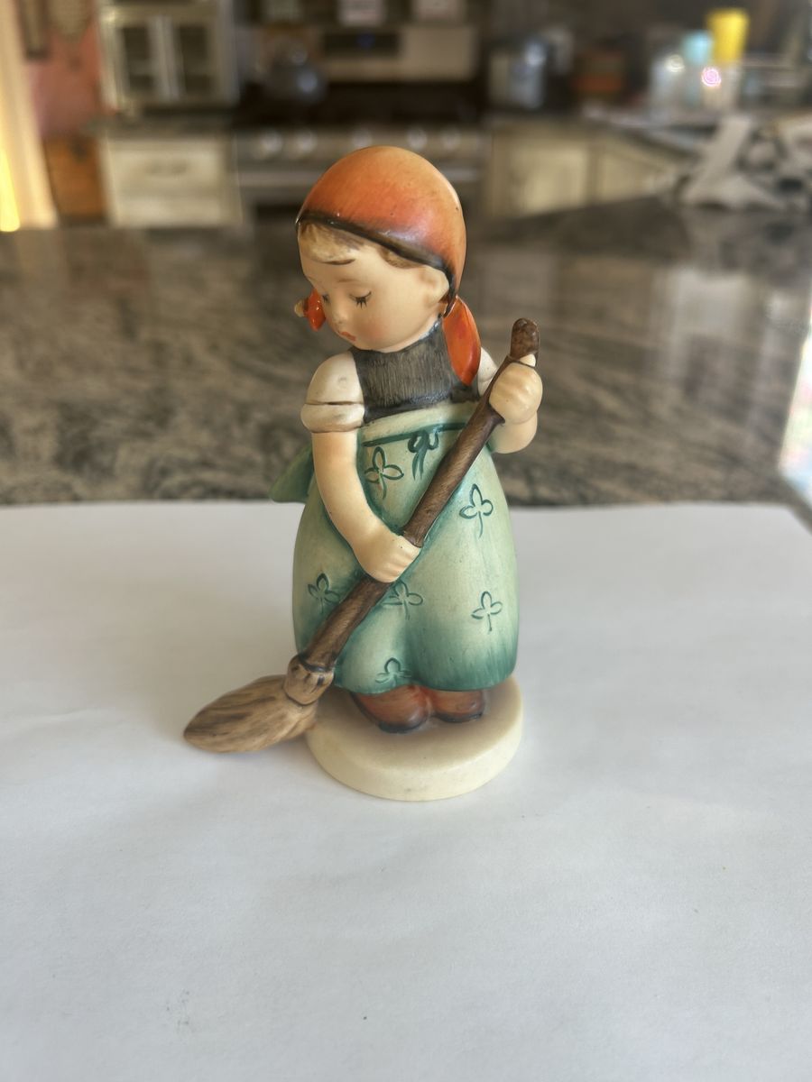 Goebel Hummel figurine commonly known as “Girl Sweeping” / “Little Housekeeper”, model 777.