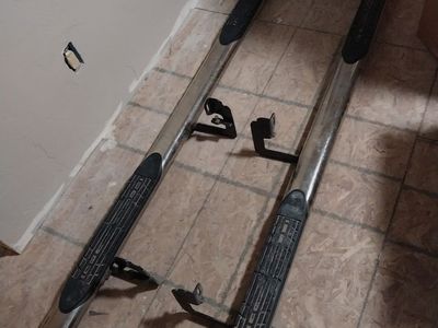 A pair of side step nerf bars for a 2006 Chevy Silverado 2500 / 2500HD (Left & Right set).