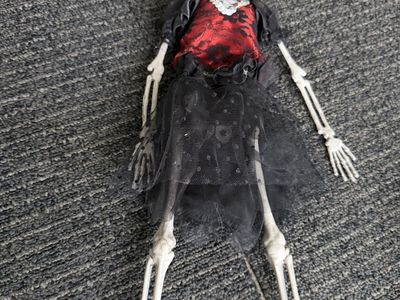 Dressed Female Skeleton Halloween Decoration with Black and Red Lace Outfit