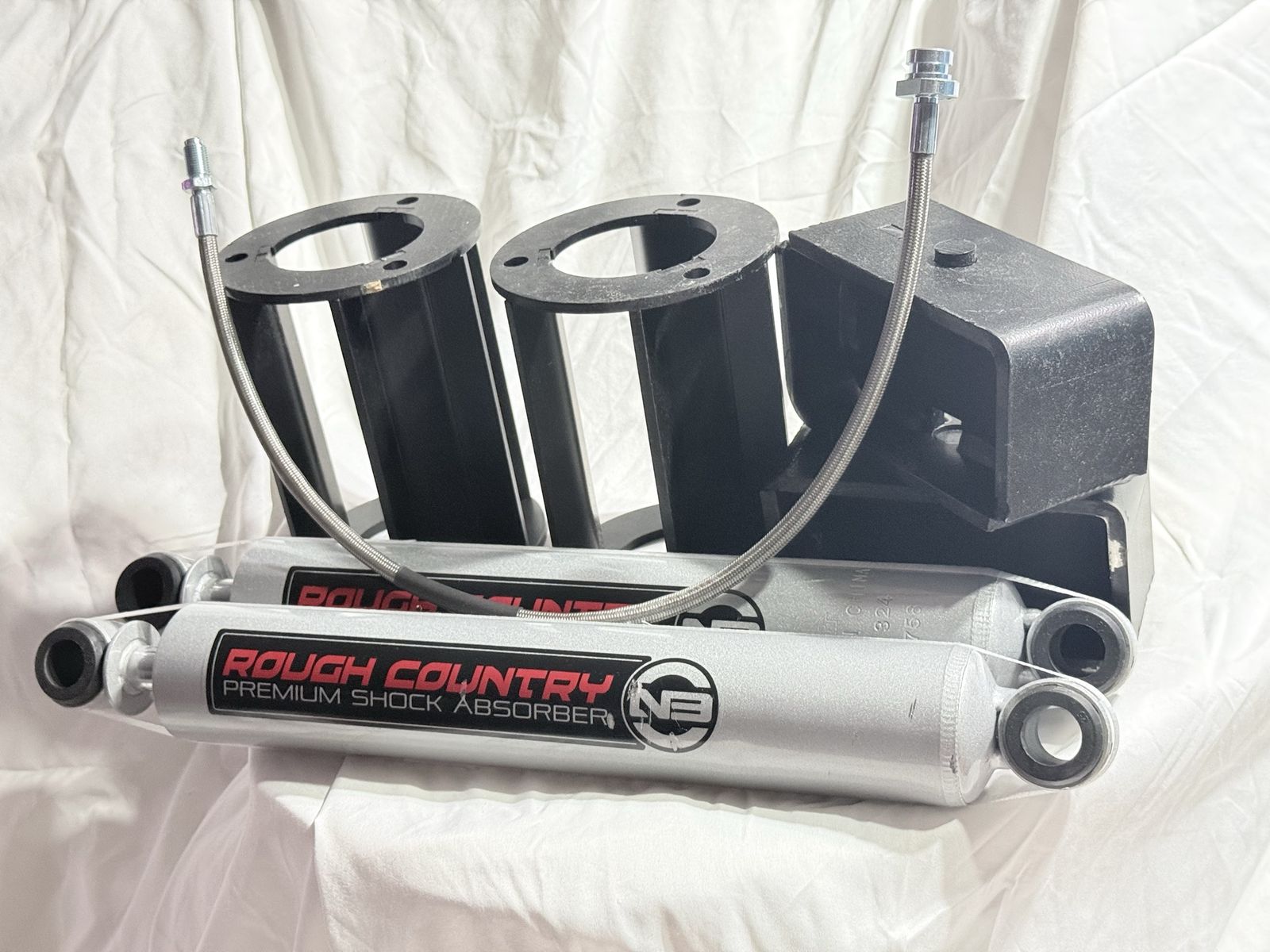 97-04 Tacoma Rough Country suspension Lift, Premium Shocks, strut spacers, blocks, stainless braided line
